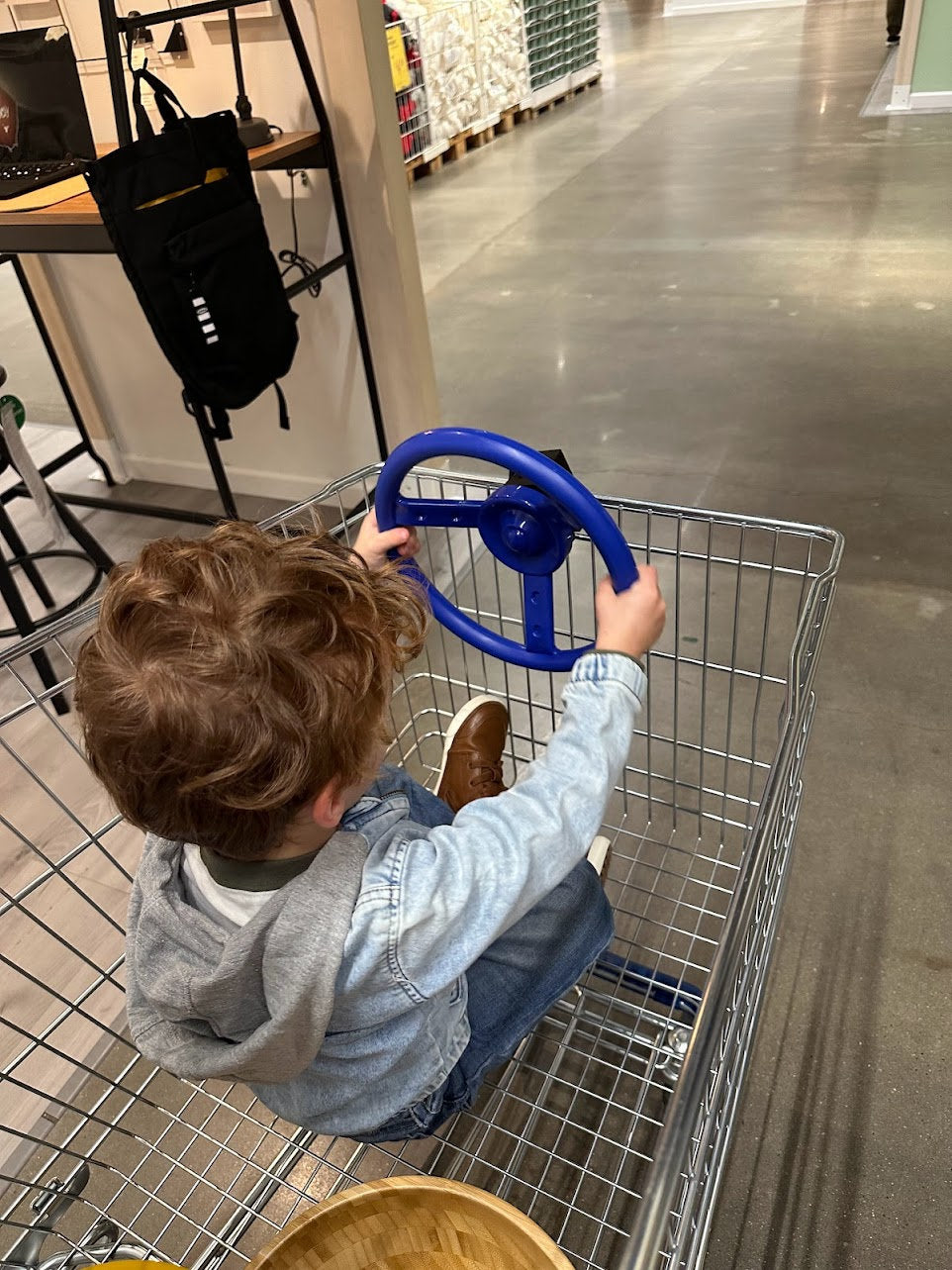 Shopping cart steering wheel